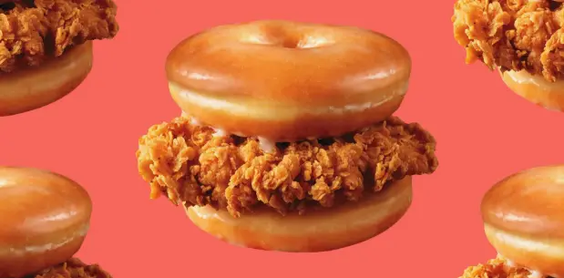 Close-up of a breaded chicken fillet in glazed donuts