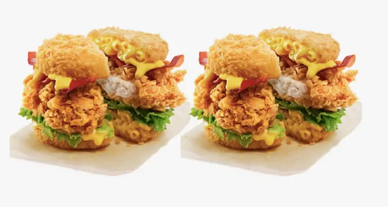 Close-up of a breaded chicken fillet with melted cheddar in a soft burger bun