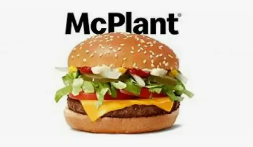 Close-up of a plant-based patty with vegan cheese in a sesame seed bun