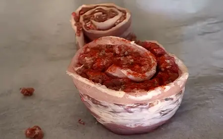 Step 2: Carefully roll it into a tight spiral, like