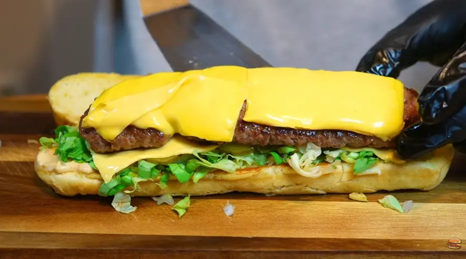 Step 7: Place the long cheesy patty into the baguette,