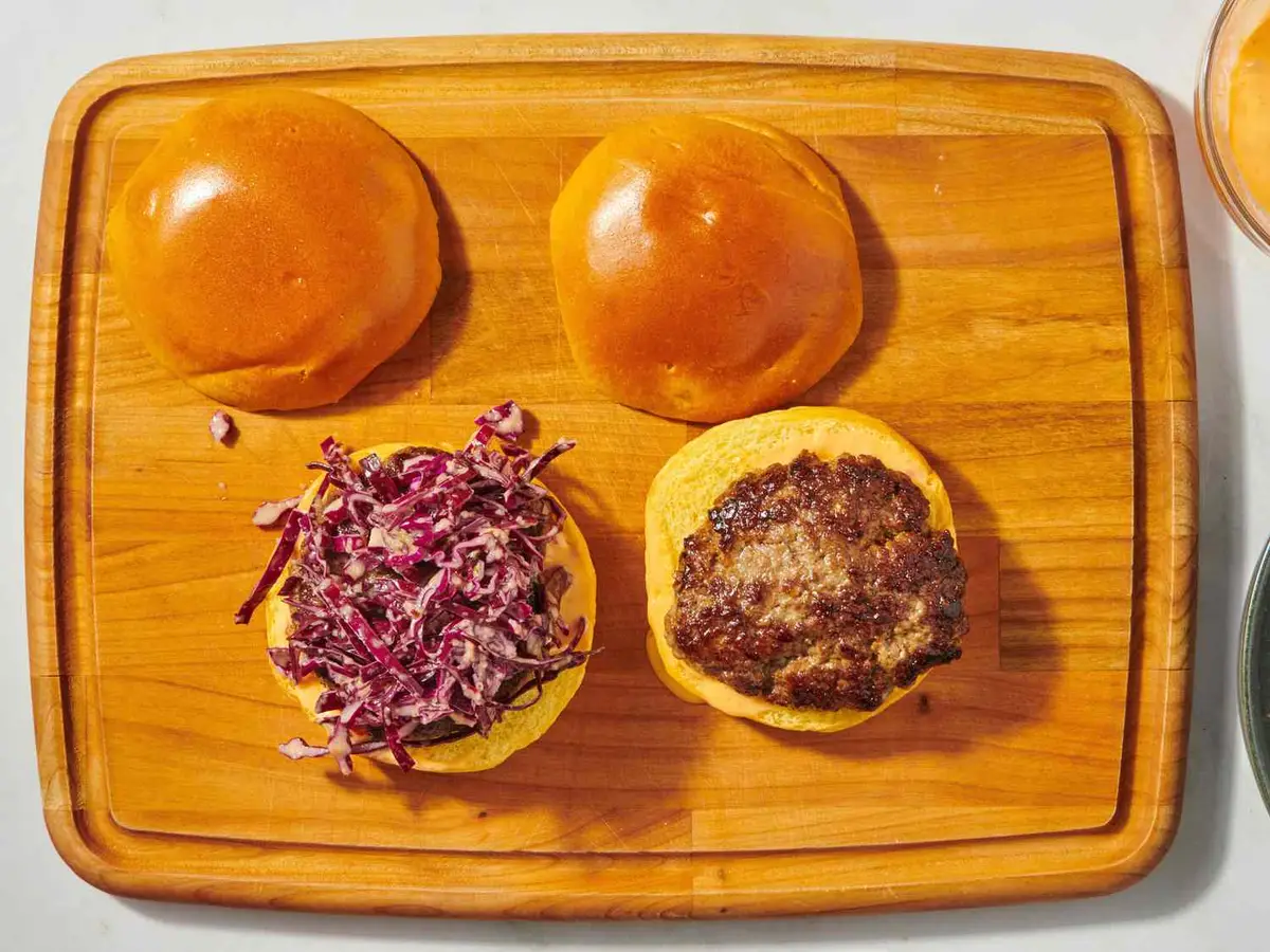 Step 6: Lay out the bottom buns, spread them generously