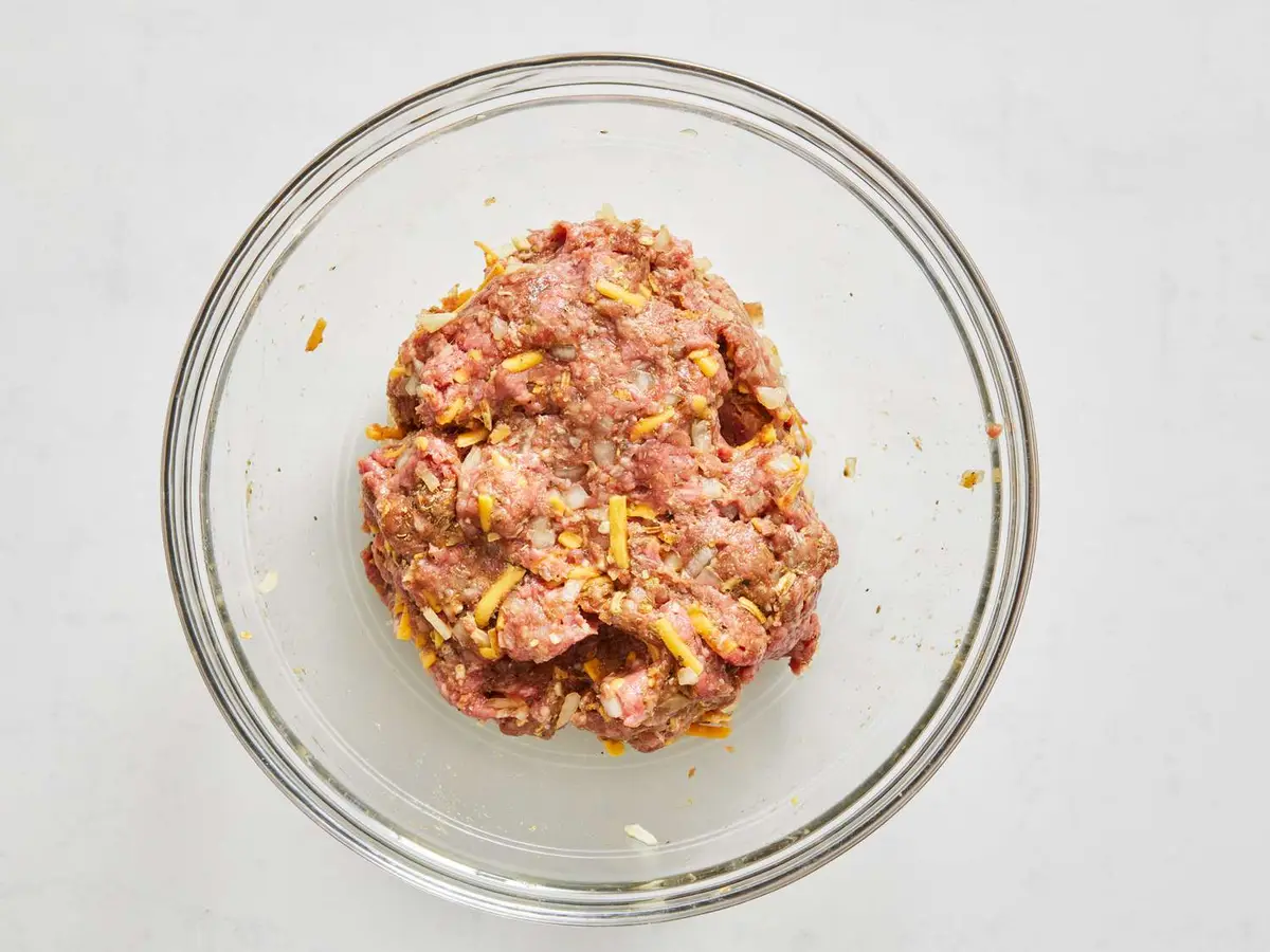 Step 2: While it heats, combine the ground beef, onion,