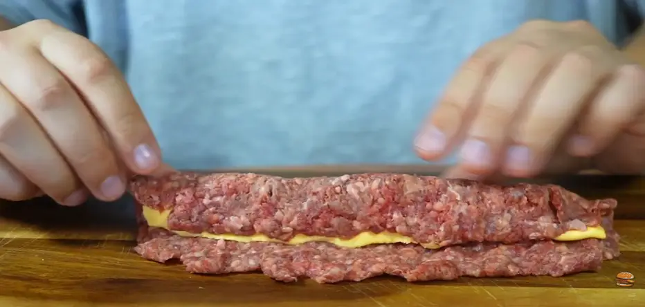 Step 2: Divide the beef into 2 portions. Flatten each