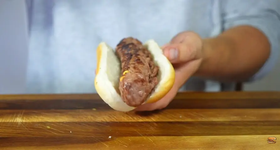 Step 7: Place the hot beef sausage inside the bun.