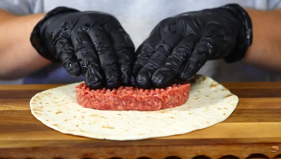 Step 2: Take a tortilla and press a portion of
