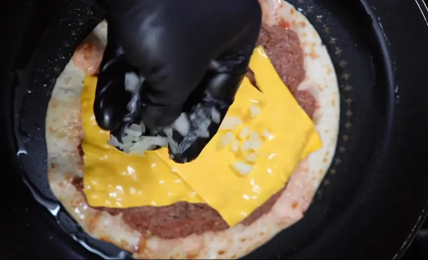 Step 5: While it’s still in the pan, start adding