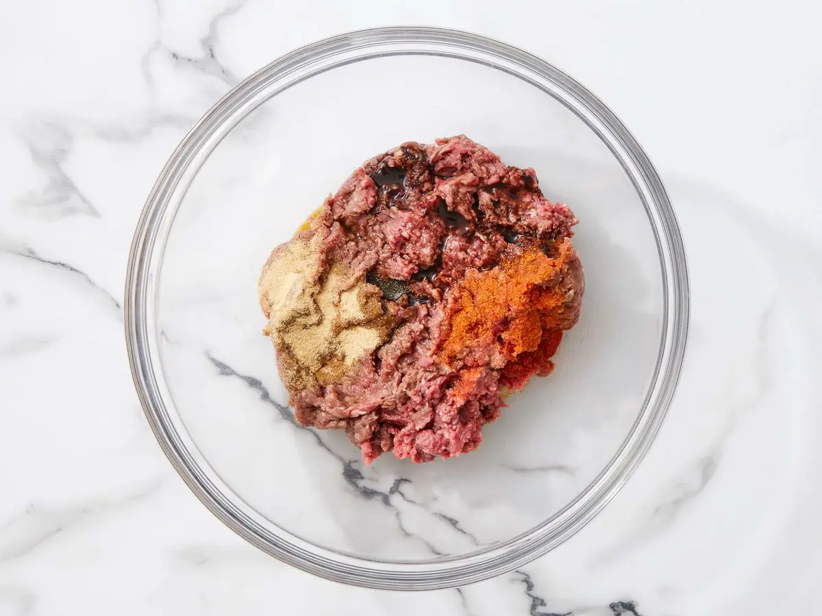 Step 3: In a medium bowl, mix the beef with