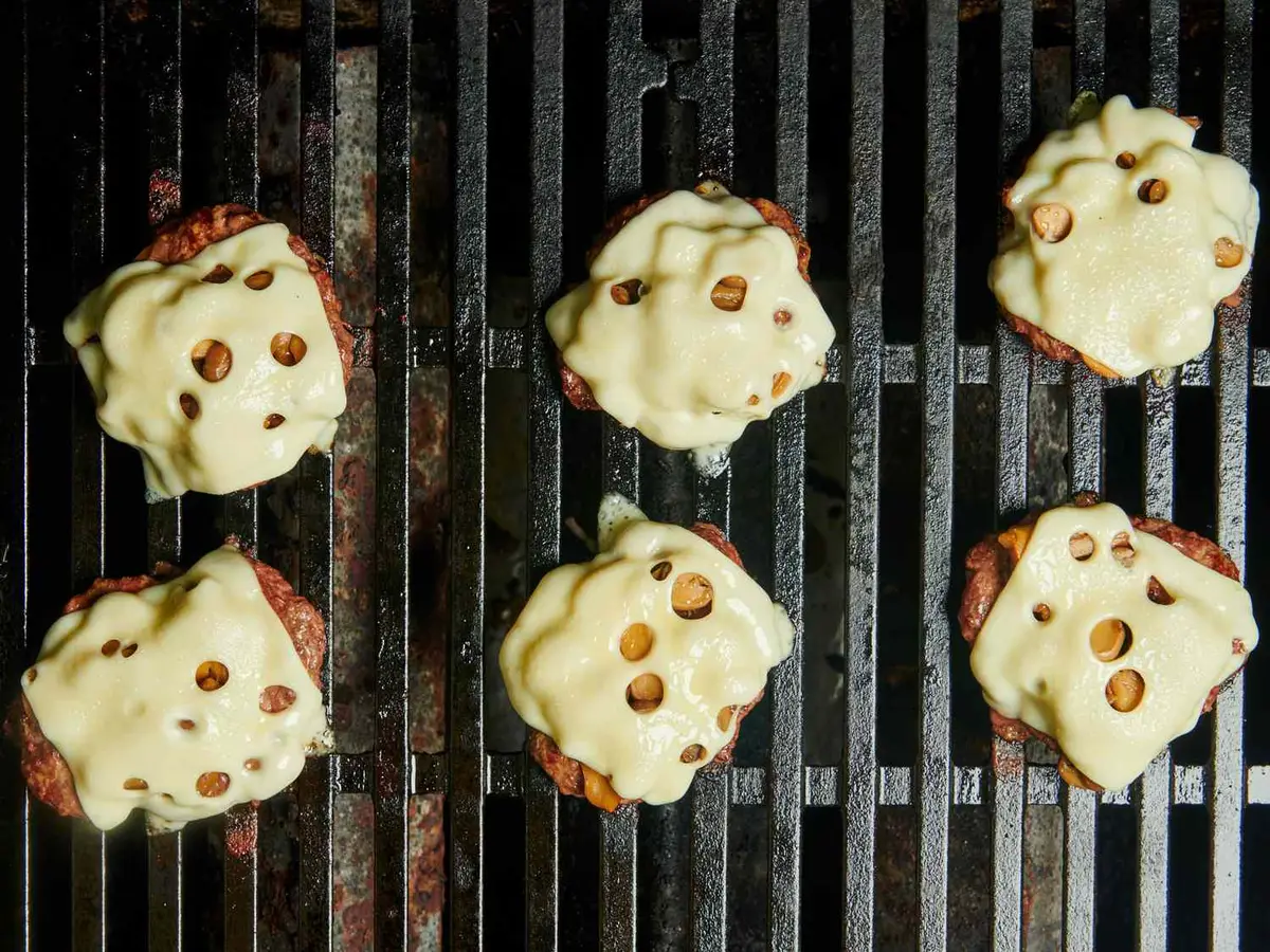 Step 5: Still on the grill, spoon the mushrooms over