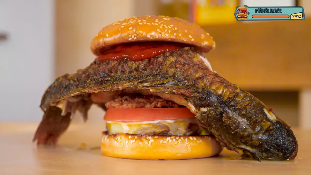 Burger: Beef, American cheese, a fried onion ring, a hash brown and a whole fried fish on top