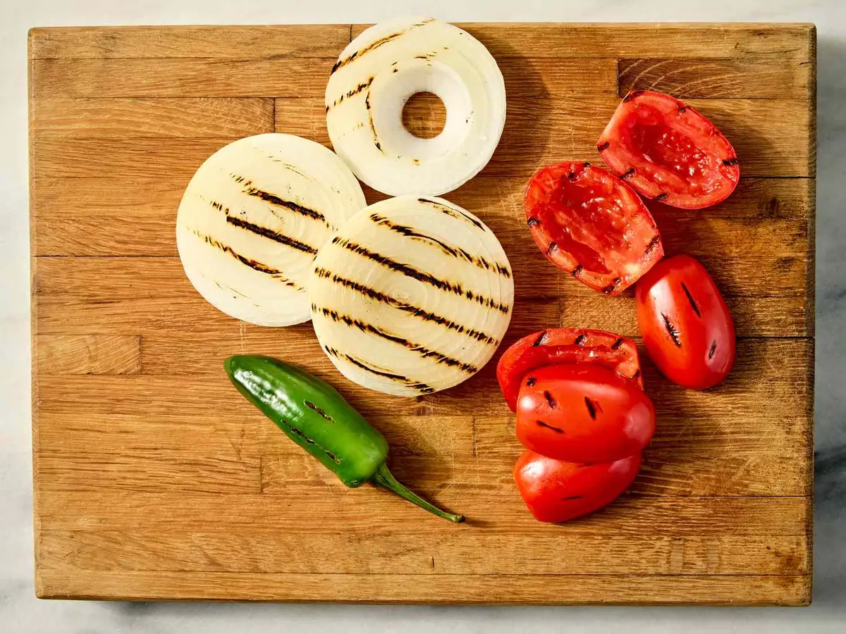 Step 2: Put the tomatoes, onion and 1 jalapeño on