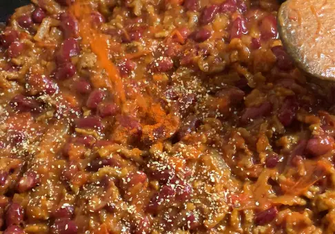 Step 4: Add 1/2 cup crushed tomatoes, 2 tbsp ketchup,