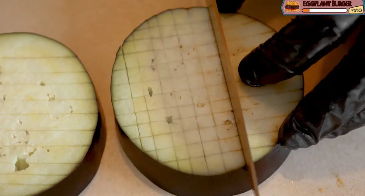 Step 1: Cut the eggplant into thick rounds and score