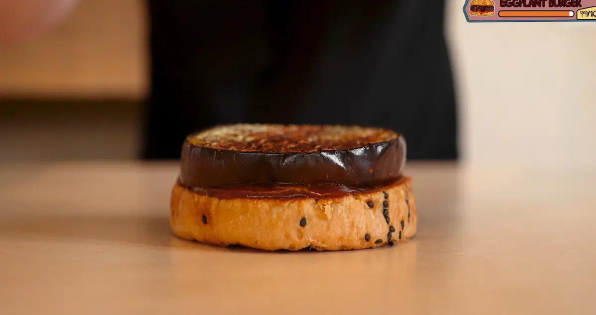 Step 4: Build: bottom bun, chocolate sauce, eggplant, more chocolate
